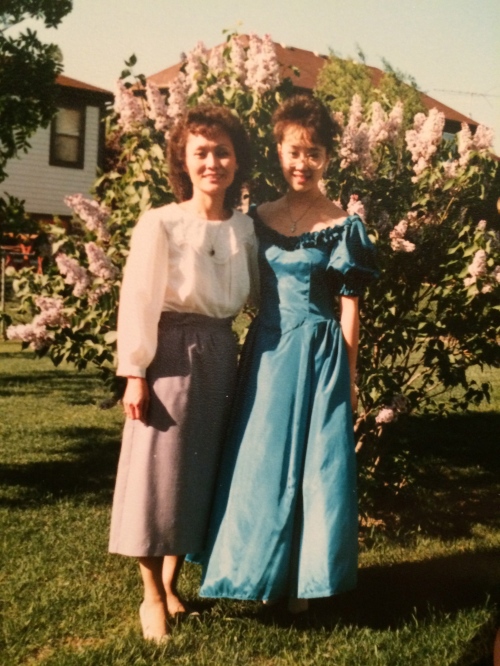 I had to go to prom because I was the junior class president. I'm sure I told you that I was that over-achieving kid in high school. I wasn't lying. Tea-length teal dress. A geek, but a stylish one. Got it from my mom, pictured here with me.
